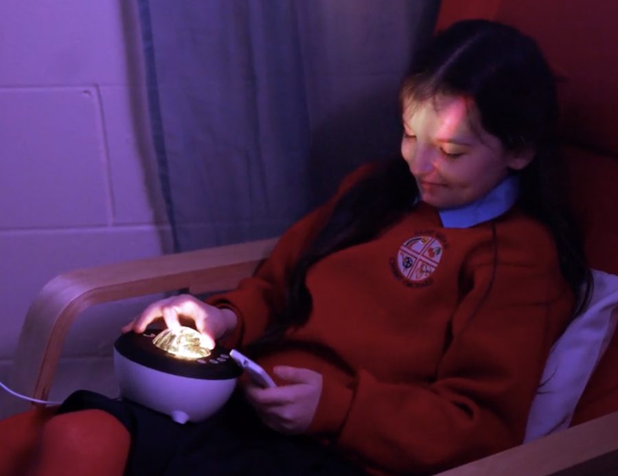 A child relaxing in the campus sensory room
