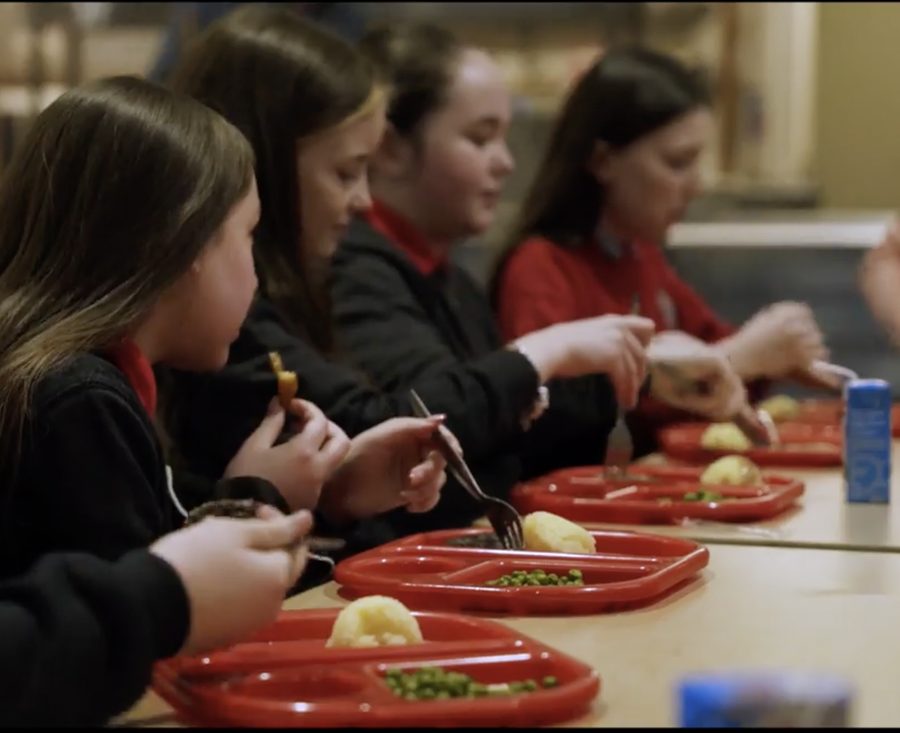 Pupils enjoying a hot school meal