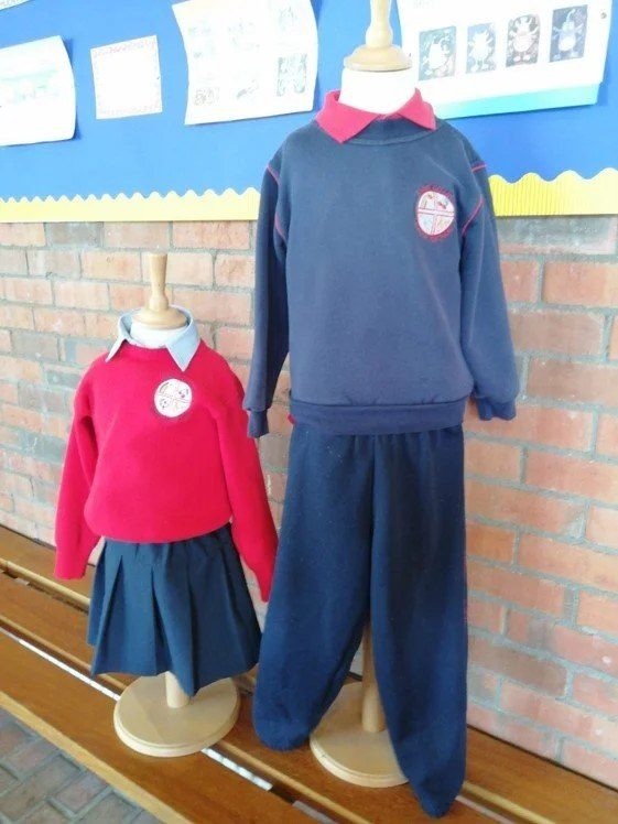 The St Ultan's school uniform and tracksuit displayed on mannequins